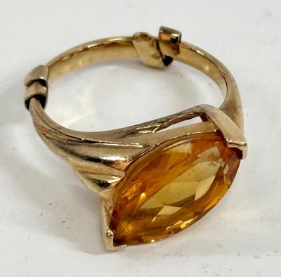 Sale Photo Thumbnail #6: Ring has an oval topaz stone approx. 5/8" x 5/16". total ring weight is 4.8g.  Very nice condition.