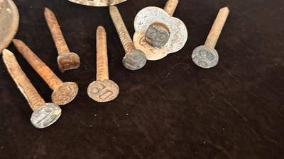 ANTIQUE RAILROAD DATE NAILS AND A GLASS MARBLE REFLECTOR