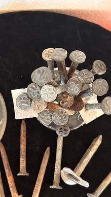 ANTIQUE RAILROAD DATE NAILS AND A GLASS MARBLE REFLECTOR