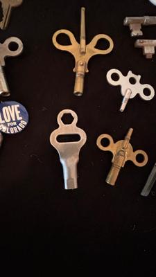 SEVERAL CLOCK KEYS, BOTTLE OPENERS AND A COUPLE SKELETON KEYS