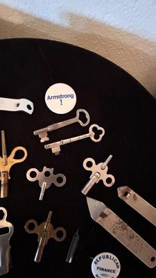 SEVERAL CLOCK KEYS, BOTTLE OPENERS AND A COUPLE SKELETON KEYS