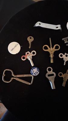SEVERAL CLOCK KEYS, BOTTLE OPENERS AND A COUPLE SKELETON KEYS