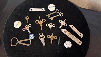 SEVERAL CLOCK KEYS, BOTTLE OPENERS AND A COUPLE SKELETON KEYS
