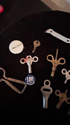 SEVERAL CLOCK KEYS, BOTTLE OPENERS AND A COUPLE SKELETON KEYS