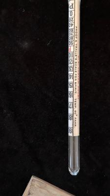 COORS TRAY, BOTTLE OPENERS, AND A GLASS GRAVITY HYDROMETER USED FOR ALCOHOL CONTENT OT BATTERY CHARGE LEVEL