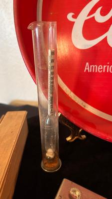 COORS TRAY, BOTTLE OPENERS, AND A GLASS GRAVITY HYDROMETER USED FOR ALCOHOL CONTENT OT BATTERY CHARGE LEVEL
