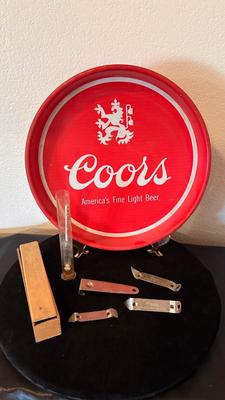 COORS TRAY, BOTTLE OPENERS, AND A GLASS GRAVITY HYDROMETER USED FOR ALCOHOL CONTENT OT BATTERY CHARGE LEVEL