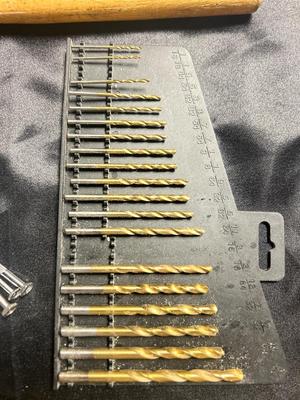 A VARIETY OF DRILL BITS, FILES AND HAND TOOLS