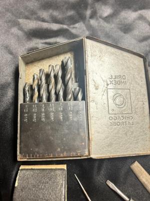 A VARIETY OF DRILL BITS, FILES AND HAND TOOLS