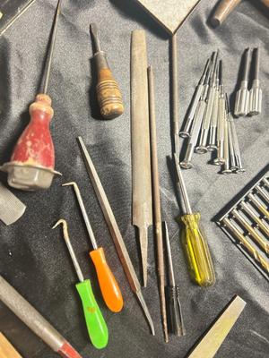 A VARIETY OF DRILL BITS, FILES AND HAND TOOLS