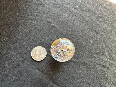HANDMADE MARBLE WITH A VIBRANT SWIRLING RAINBOW DESIGN