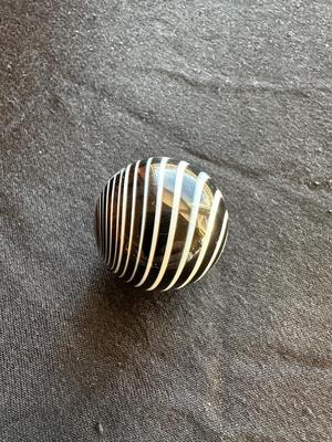 SIGNED GLASS MARBLE WITH BLACK AND WHITE SWIRLS