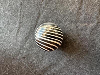 SIGNED GLASS MARBLE WITH BLACK AND WHITE SWIRLS
