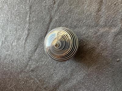 SIGNED GLASS MARBLE WITH BLACK AND WHITE SWIRLS