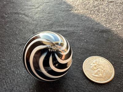 SIGNED GLASS MARBLE WITH BLACK AND WHITE SWIRLS