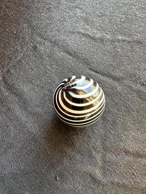 SIGNED GLASS MARBLE WITH BLACK AND WHITE SWIRLS