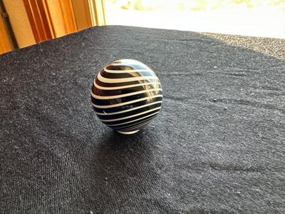 SIGNED GLASS MARBLE WITH BLACK AND WHITE SWIRLS