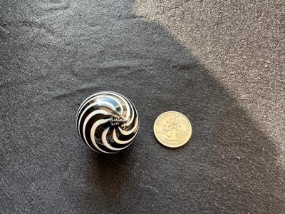 SIGNED GLASS MARBLE WITH BLACK AND WHITE SWIRLS