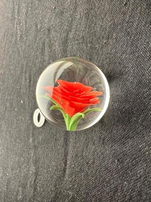 HANDBLOWN RED/ORANGE FLOWER ENCASED IN CLEAR GLASS MARBLE