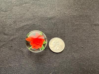 HANDBLOWN RED/ORANGE FLOWER ENCASED IN CLEAR GLASS MARBLE