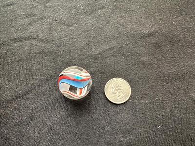 HANDBLOWN MULTICOLORED MARBLE WITH A DYNAMIC SWIRLING DESIGN