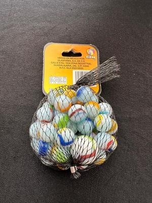 A JAR AND UNOPENED BAG OF MARBLES