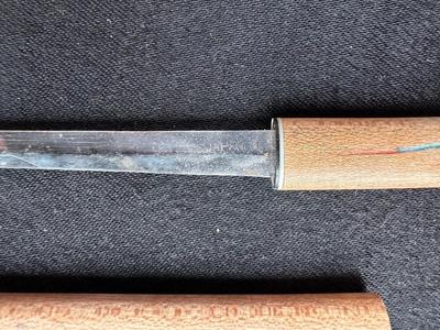 A VARIETY OF KNIVES AND A SHARPENING STONE