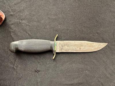 A VARIETY OF KNIVES AND A SHARPENING STONE