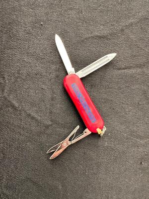 A VARIETY OF KNIVES AND A SHARPENING STONE