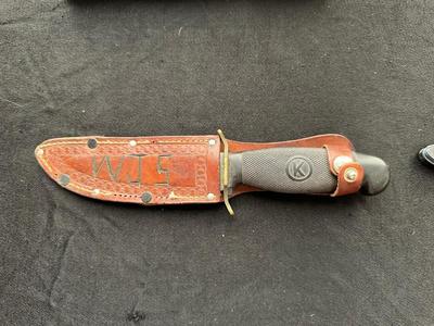 A VARIETY OF KNIVES AND A SHARPENING STONE
