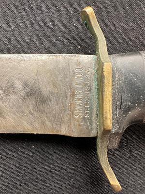 A VARIETY OF KNIVES AND A SHARPENING STONE