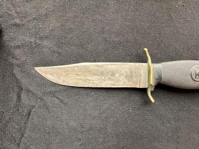 A VARIETY OF KNIVES AND A SHARPENING STONE