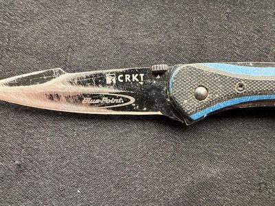 A VARIETY OF KNIVES AND A SHARPENING STONE