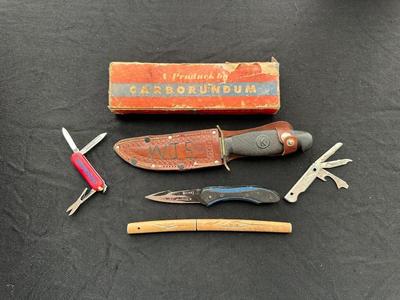 A VARIETY OF KNIVES AND A SHARPENING STONE