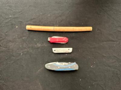 A VARIETY OF KNIVES AND A SHARPENING STONE