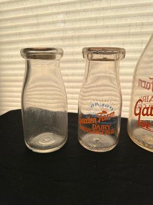 GLASS MILK BOTTLES, SOME FROM LOCAL DAIRIES
