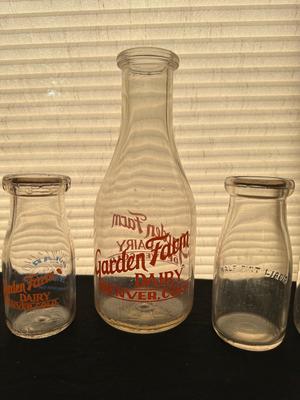 GLASS MILK BOTTLES, SOME FROM LOCAL DAIRIES