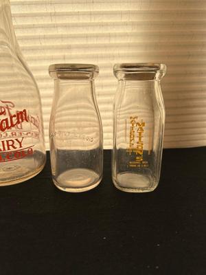 GLASS MILK BOTTLES, SOME FROM LOCAL DAIRIES