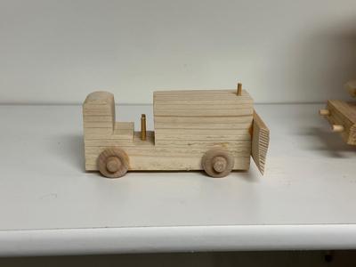 HANDCRAFTED WOODEN TOYS 1 LARGE, 1 SMALL SIZE WITH EMBEDDED PENNY FOR YEAR MADE
