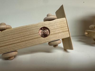 HANDCRAFTED WOODEN TOYS 1 LARGE, 1 SMALL SIZE WITH EMBEDDED PENNY FOR YEAR MADE