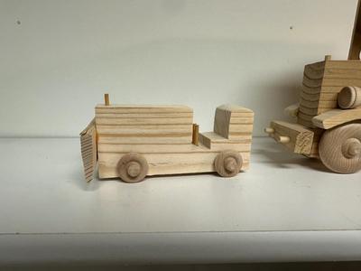 HANDCRAFTED WOODEN TOYS 1 LARGE, 1 SMALL SIZE WITH EMBEDDED PENNY FOR YEAR MADE