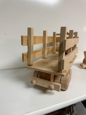 HANDCRAFTED 1 LARGE, 1 MED SIZE WOODEN TOYS WITH EMBEDDED PENNY FOR YEAR MADE