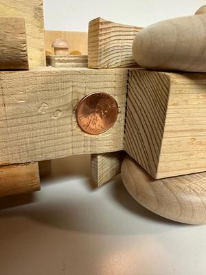 HANDCRAFTED WOODEN TOYS 1 LARGE, 1 MED SIZE WITH EMBEDDED PENNY FOR YEAR MADE