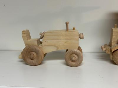 HANDCRAFTED WOODEN TOYS 1 LARGE, 1 MED SIZE WITH EMBEDDED PENNY FOR YEAR MADE