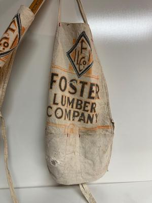 3 FOSTER LUMBER CO APRONS AND 1 YARD STICK