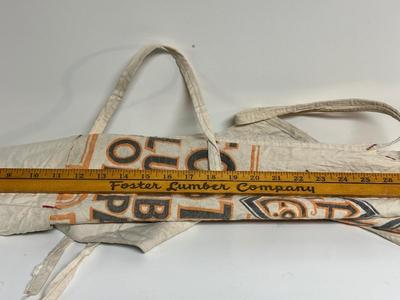 3 FOSTER LUMBER CO APRONS AND 1 YARD STICK