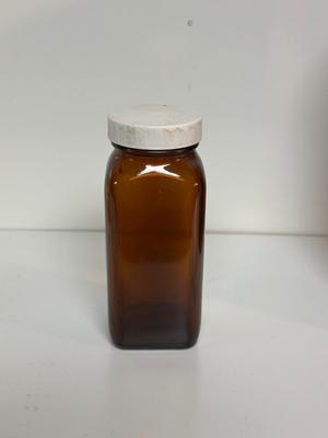 BROWN GLASS JUG AND BOTTLES