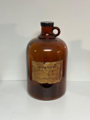 BROWN GLASS JUG AND BOTTLES