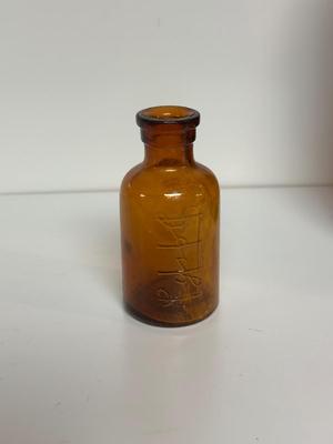 BROWN GLASS JUG AND BOTTLES