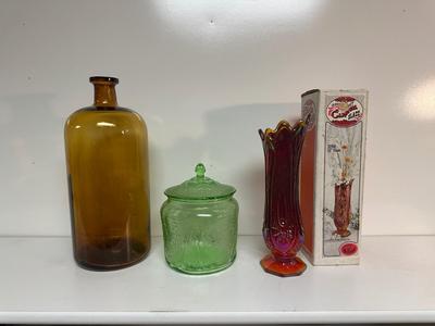 IRIDESCENT SUNSET CARNIVAL GLASS VASE, GREEN DEPRESSION GLASS COOKIE JAR AND BROWN GLASS BOTTLE